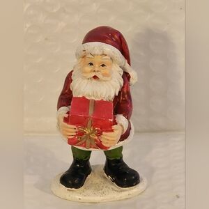 Festive Santa Claus Figurine with Red Gift